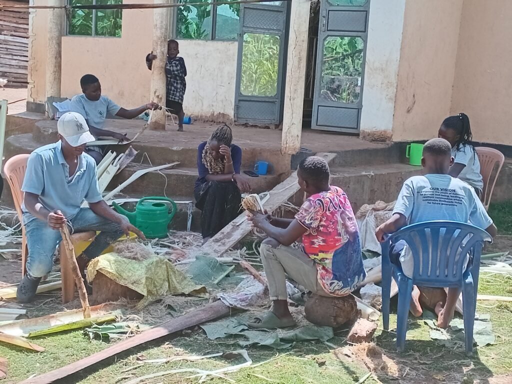 The Jukye BananaPak team working together outside the workshop in Kabuyanda, Isingiro District
