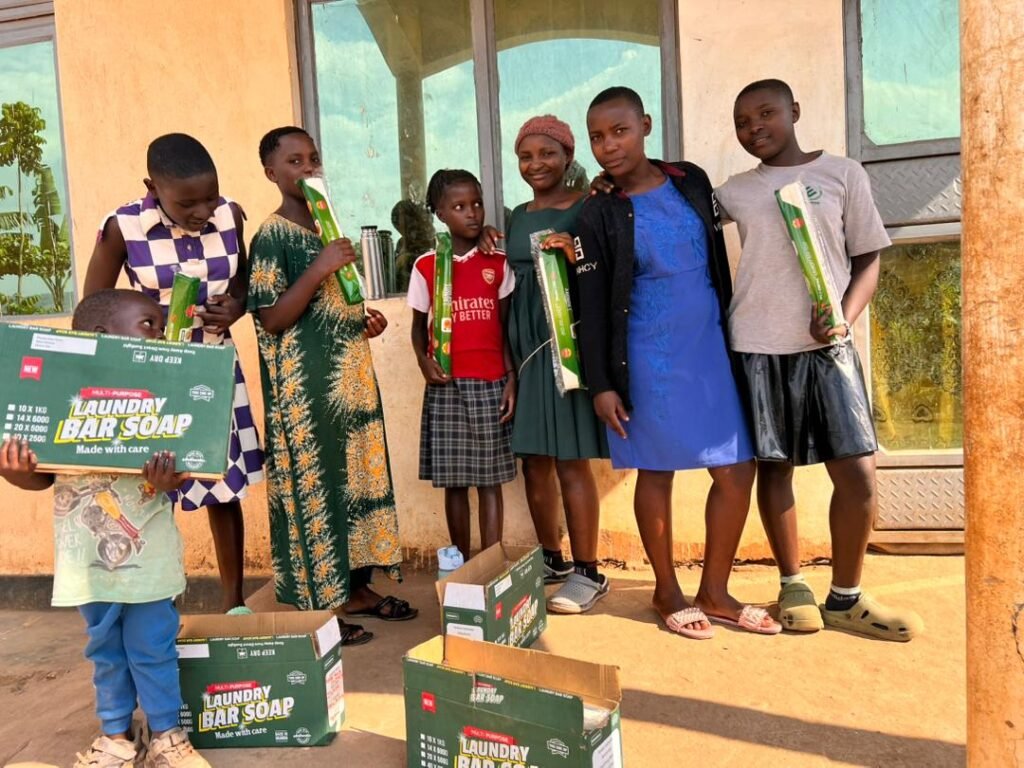 Young distributors holding sleeved Jukye bars and retail cases